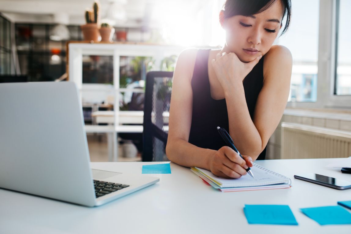Teenager using sticky notes